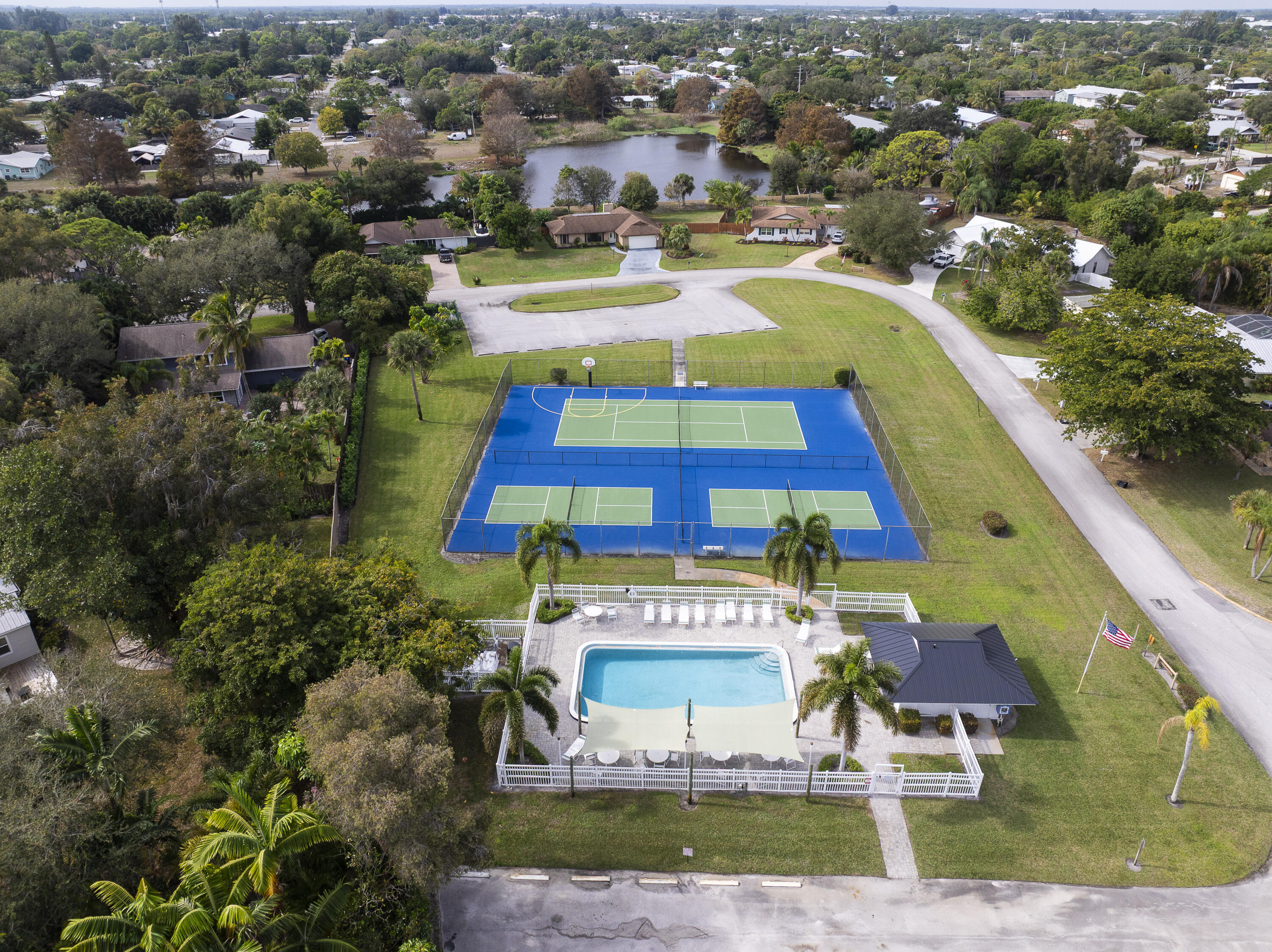 3035 Southeast Glasgow Drive Stuart, FL 34997 - Photo 50 of 52 an aerial view of residential houses with outdoor space and swimming pool