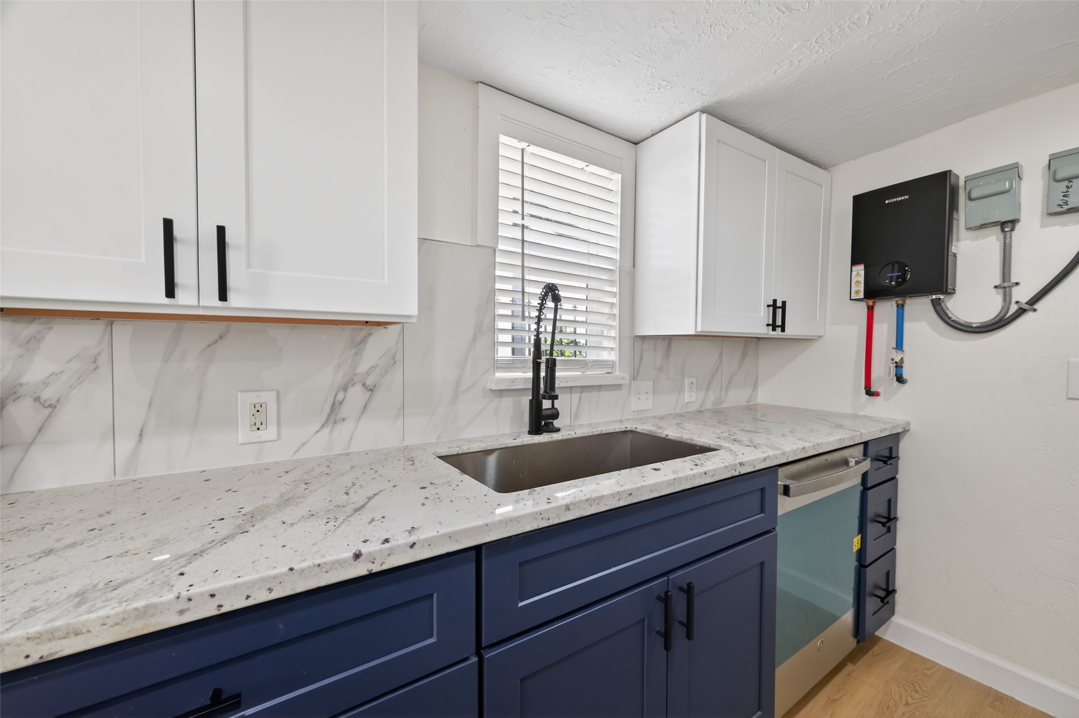 2118 Webster Street, Unit 3 Houston, TX 77003 - Photo 11 of 29 a kitchen with a sink and cabinets