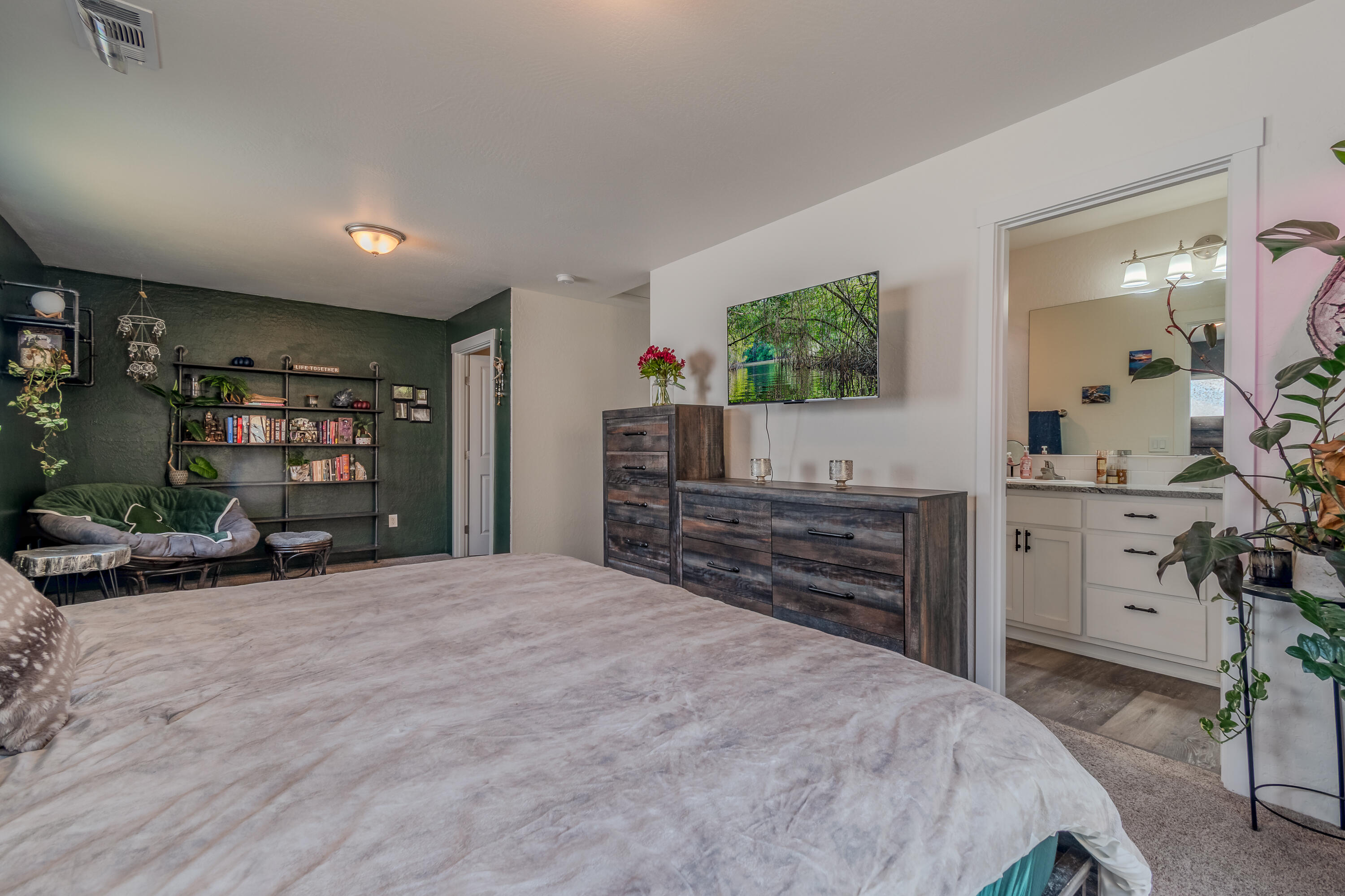 21 Cerulean Terrace Eagle Point, OR 97524 - Photo 19 of 30 a bedroom with a bed and a flat screen tv