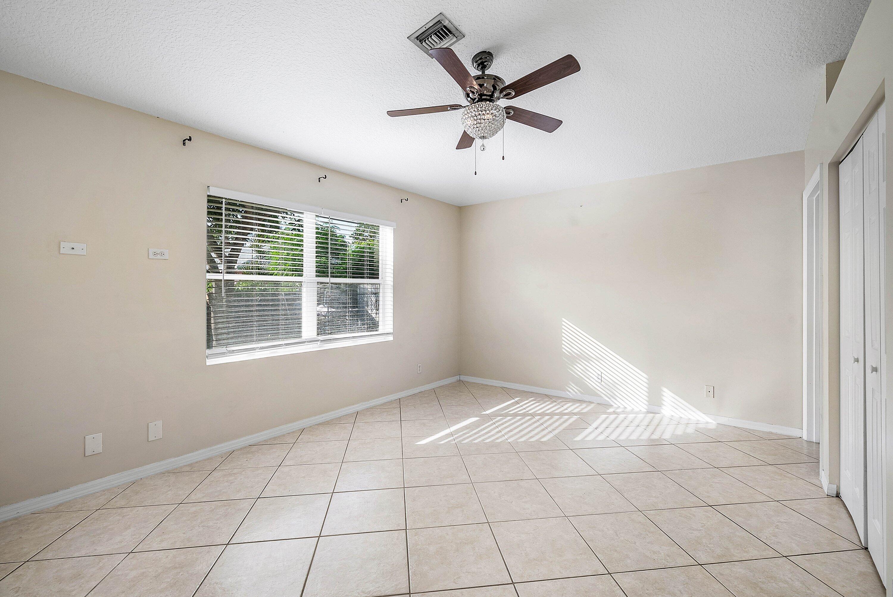 177 Heming Way Boynton Beach, FL 33426 - Photo 11 of 28 a view of an empty room with a window