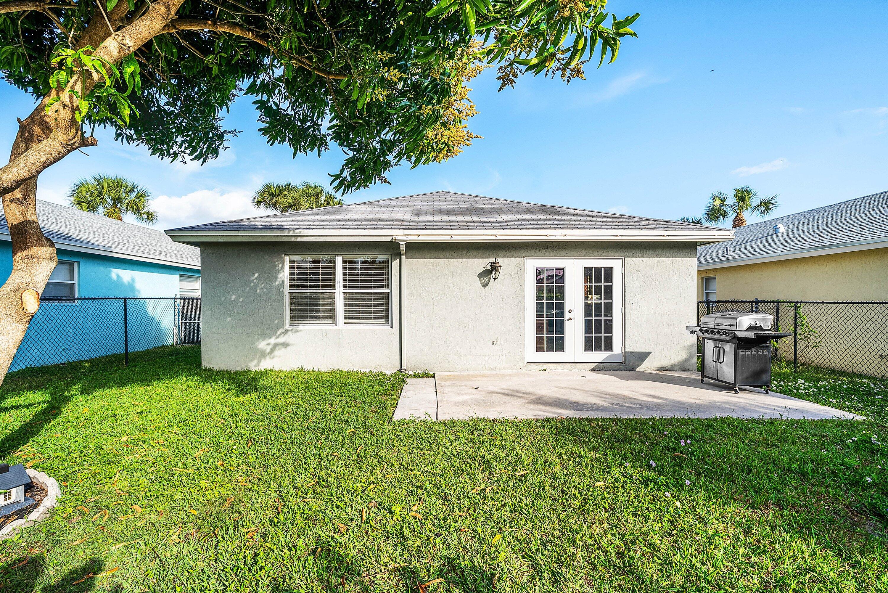 177 Heming Way Boynton Beach, FL 33426 - Photo 26 of 28 a house view with a garden space