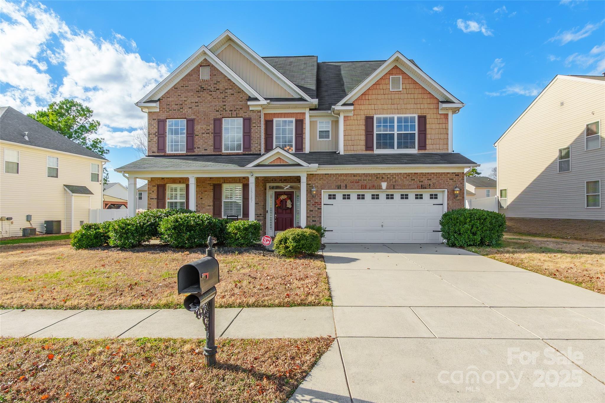 15127 Taylor Ridge Lane Charlotte, NC 28273 - Photo 1 of 42 a front view of a house with swimming pool