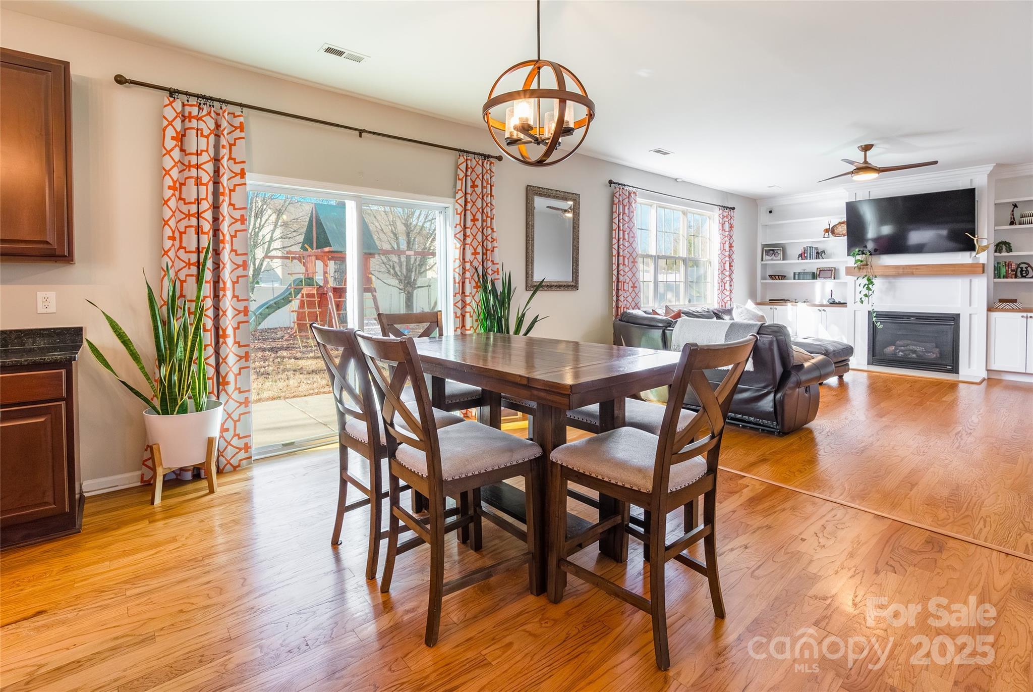 15127 Taylor Ridge Lane Charlotte, NC 28273 - Photo 11 of 42 a view of a dining room with furniture window and wooden floor