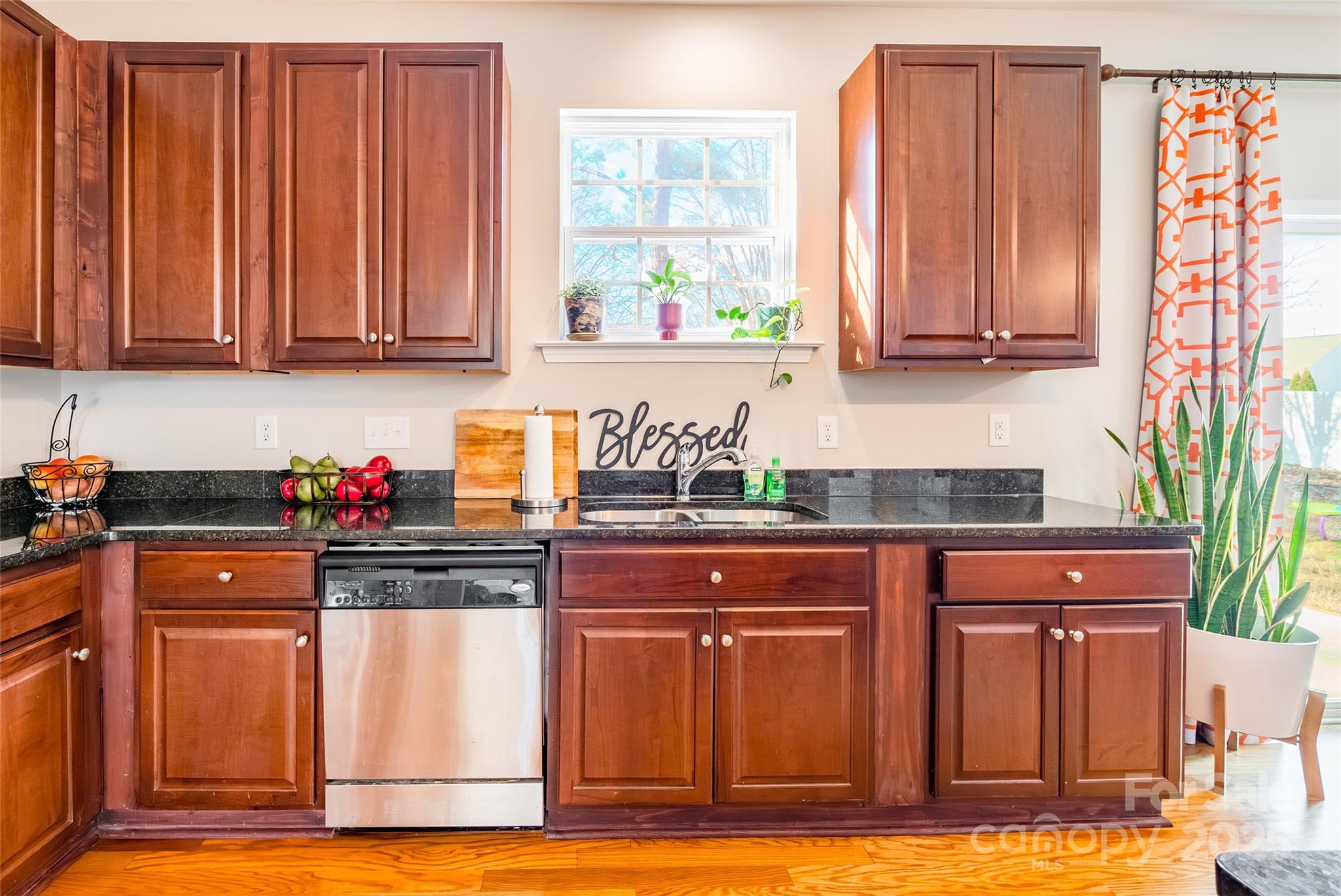 15127 Taylor Ridge Lane Charlotte, NC 28273 - Photo 14 of 42 a kitchen with granite countertop wooden cabinets and a sink