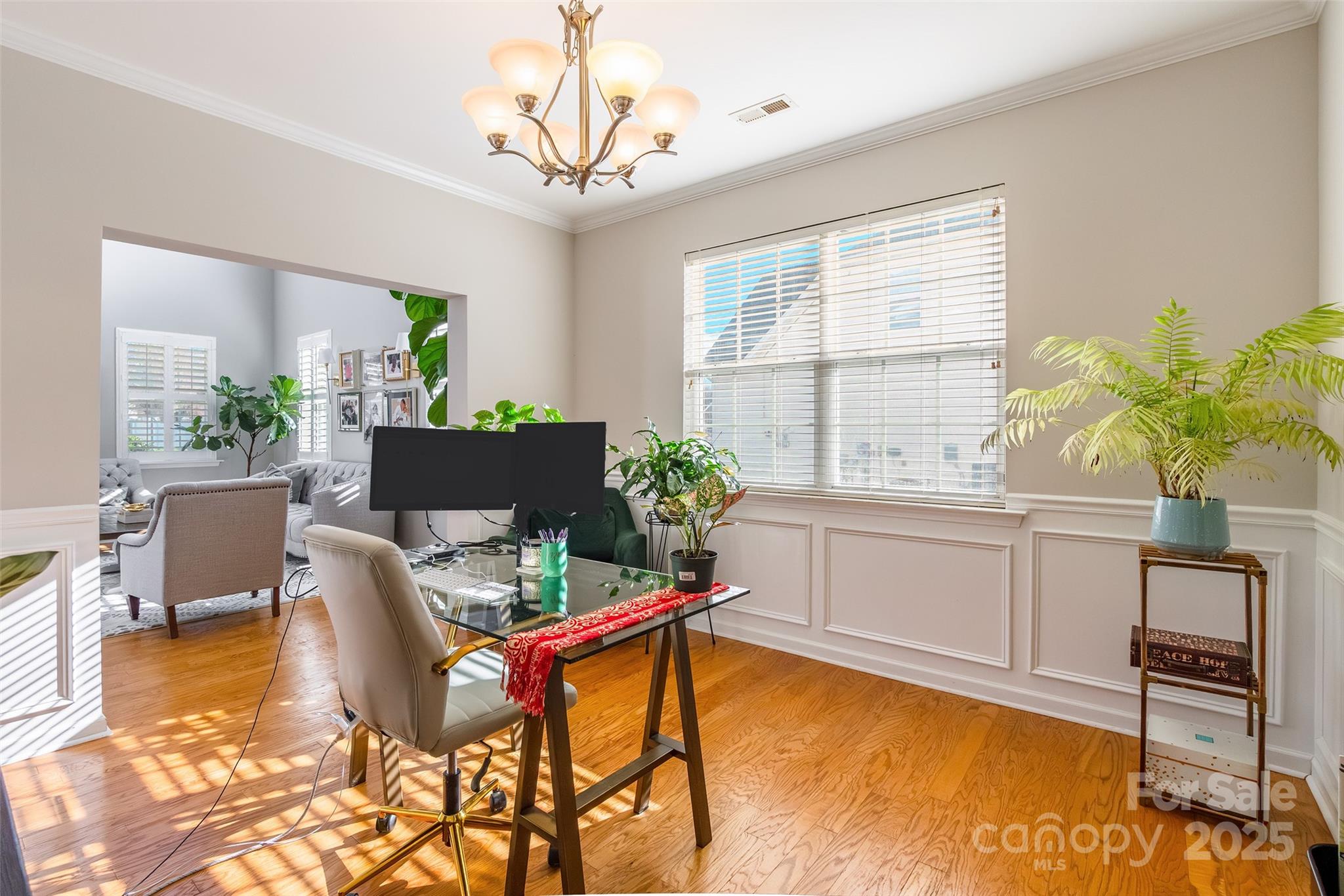 15127 Taylor Ridge Lane Charlotte, NC 28273 - Photo 18 of 42 a living room with furniture and a potted plant