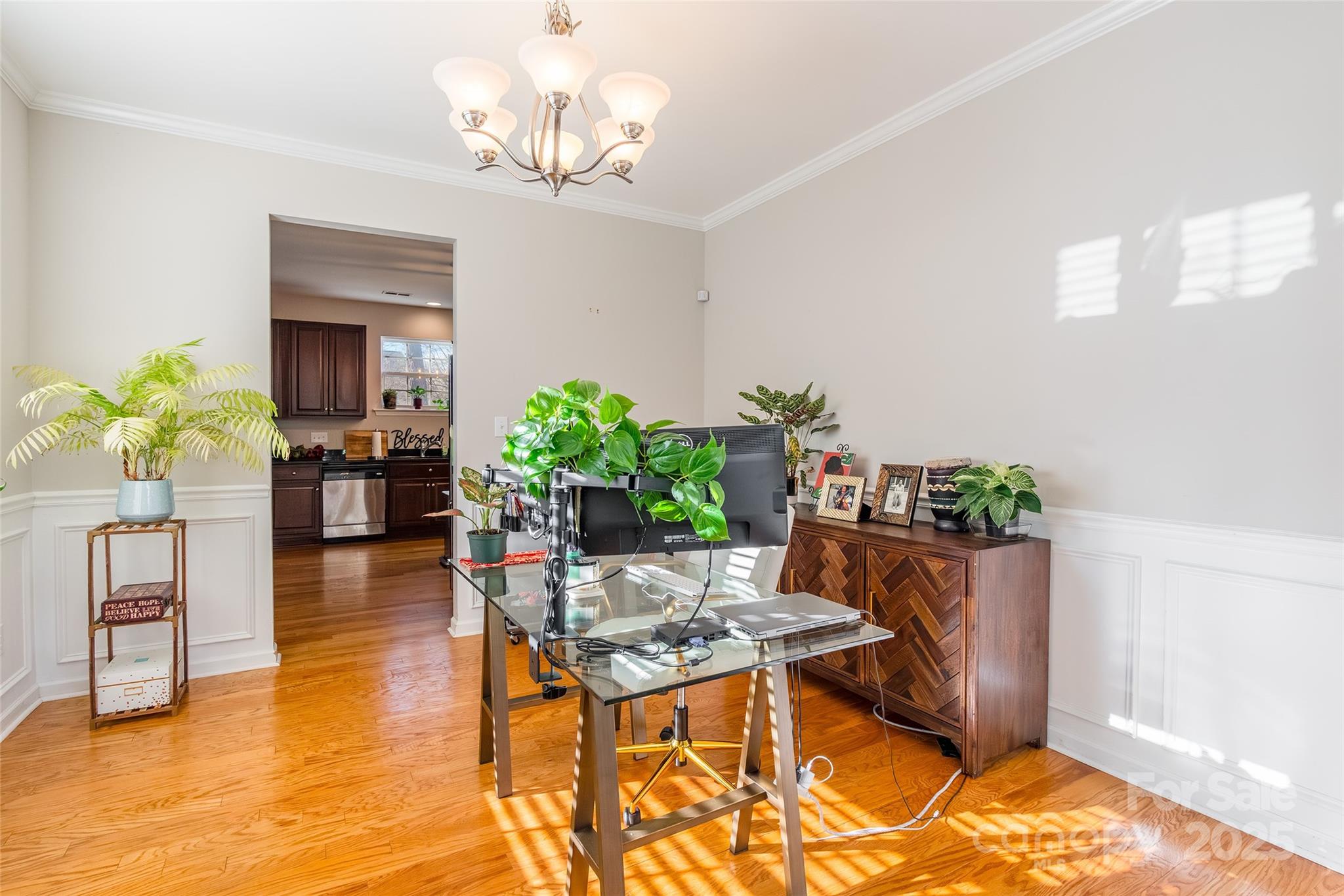 15127 Taylor Ridge Lane Charlotte, NC 28273 - Photo 19 of 42 a living room with furniture and a chandelier