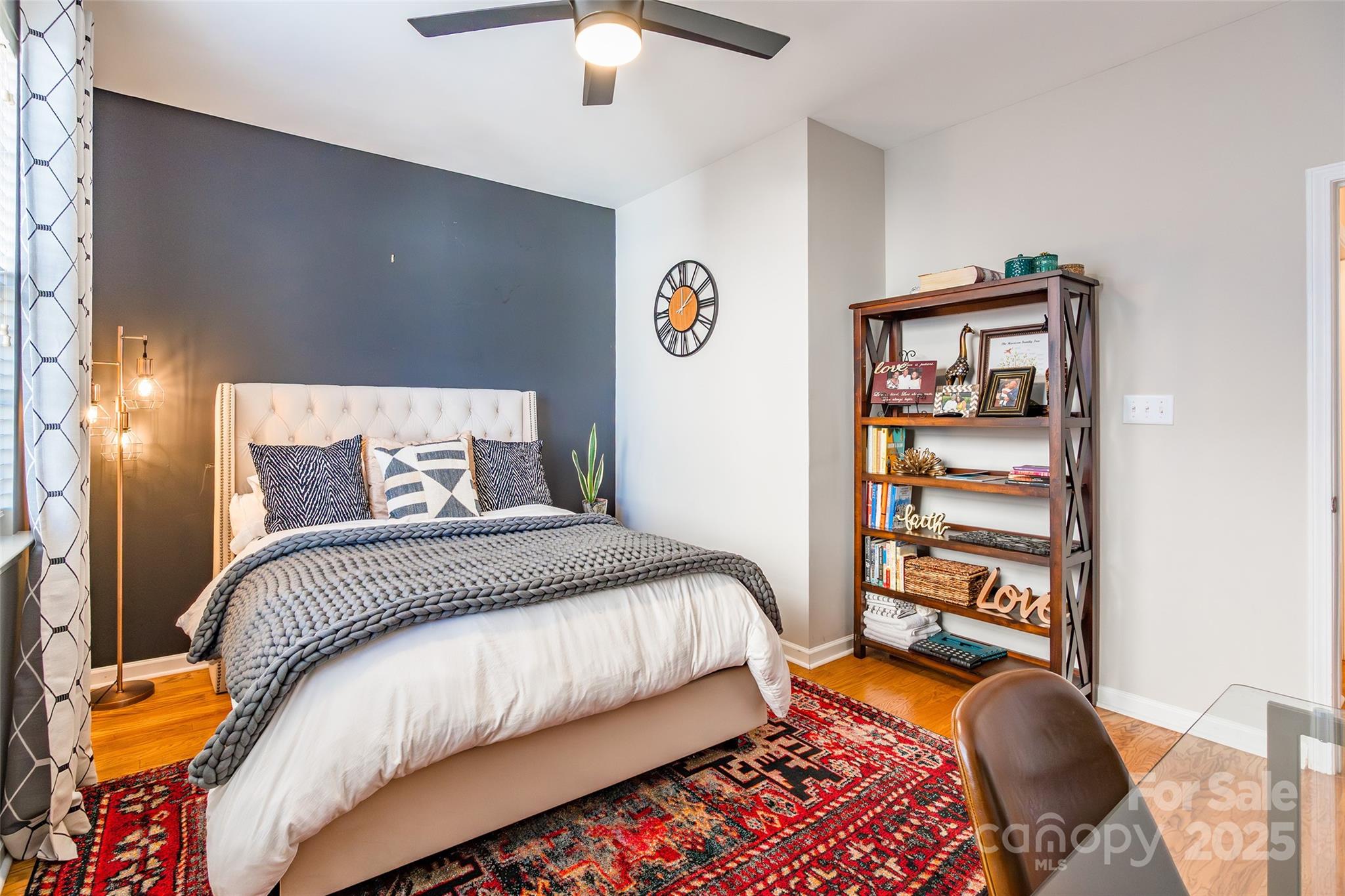 15127 Taylor Ridge Lane Charlotte, NC 28273 - Photo 21 of 42 a bedroom with a bed and a chandelier