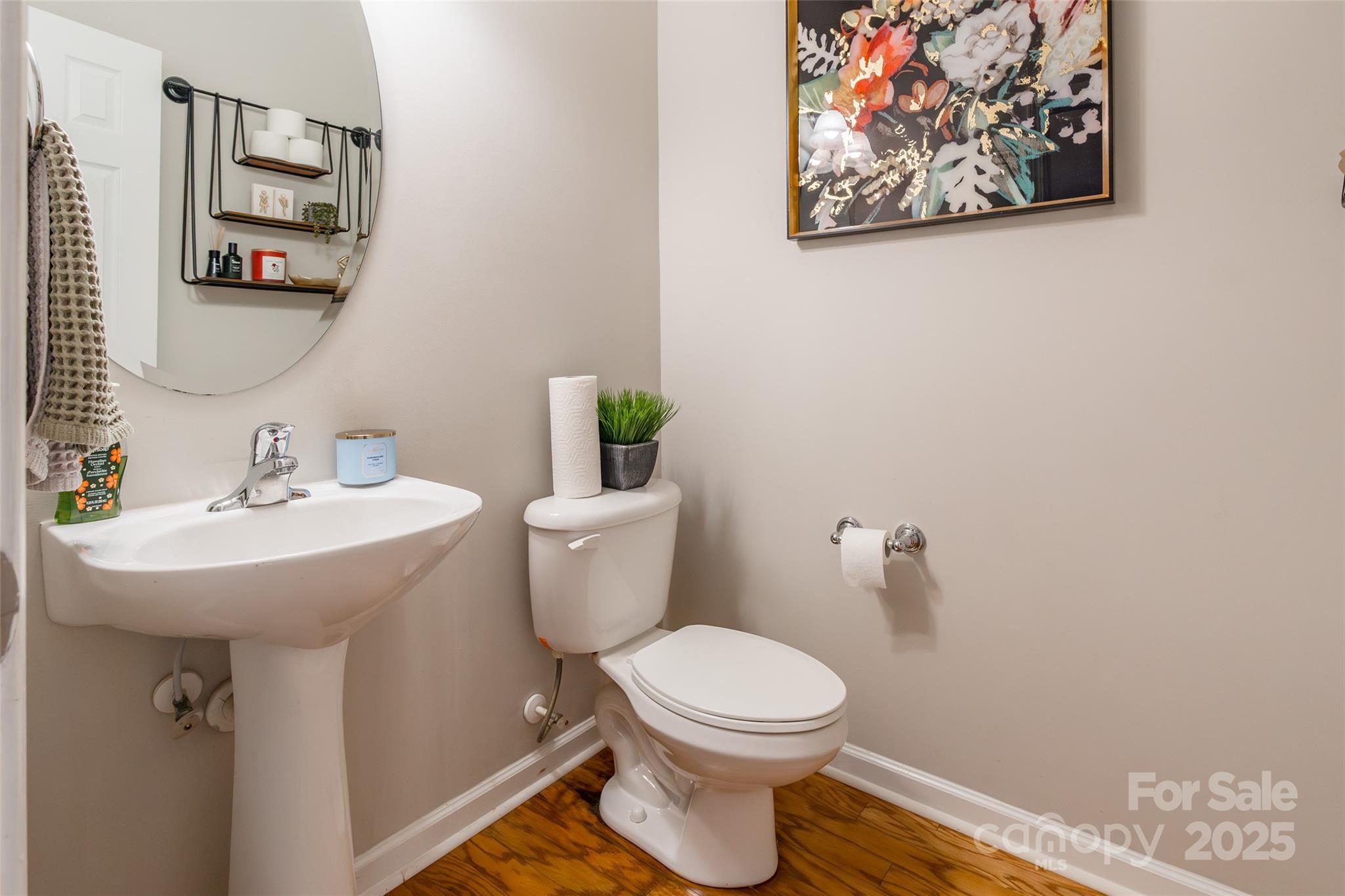 15127 Taylor Ridge Lane Charlotte, NC 28273 - Photo 23 of 42 a bathroom with a toilet a sink and mirror