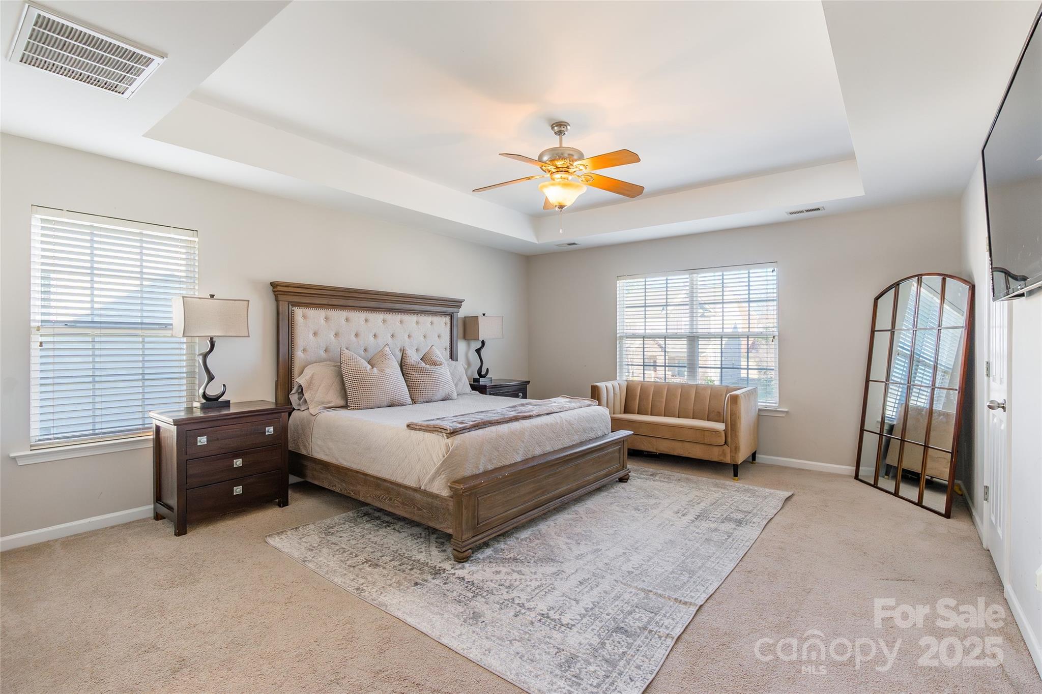 15127 Taylor Ridge Lane Charlotte, NC 28273 - Photo 25 of 42 a bedroom with a bed a couch and a window