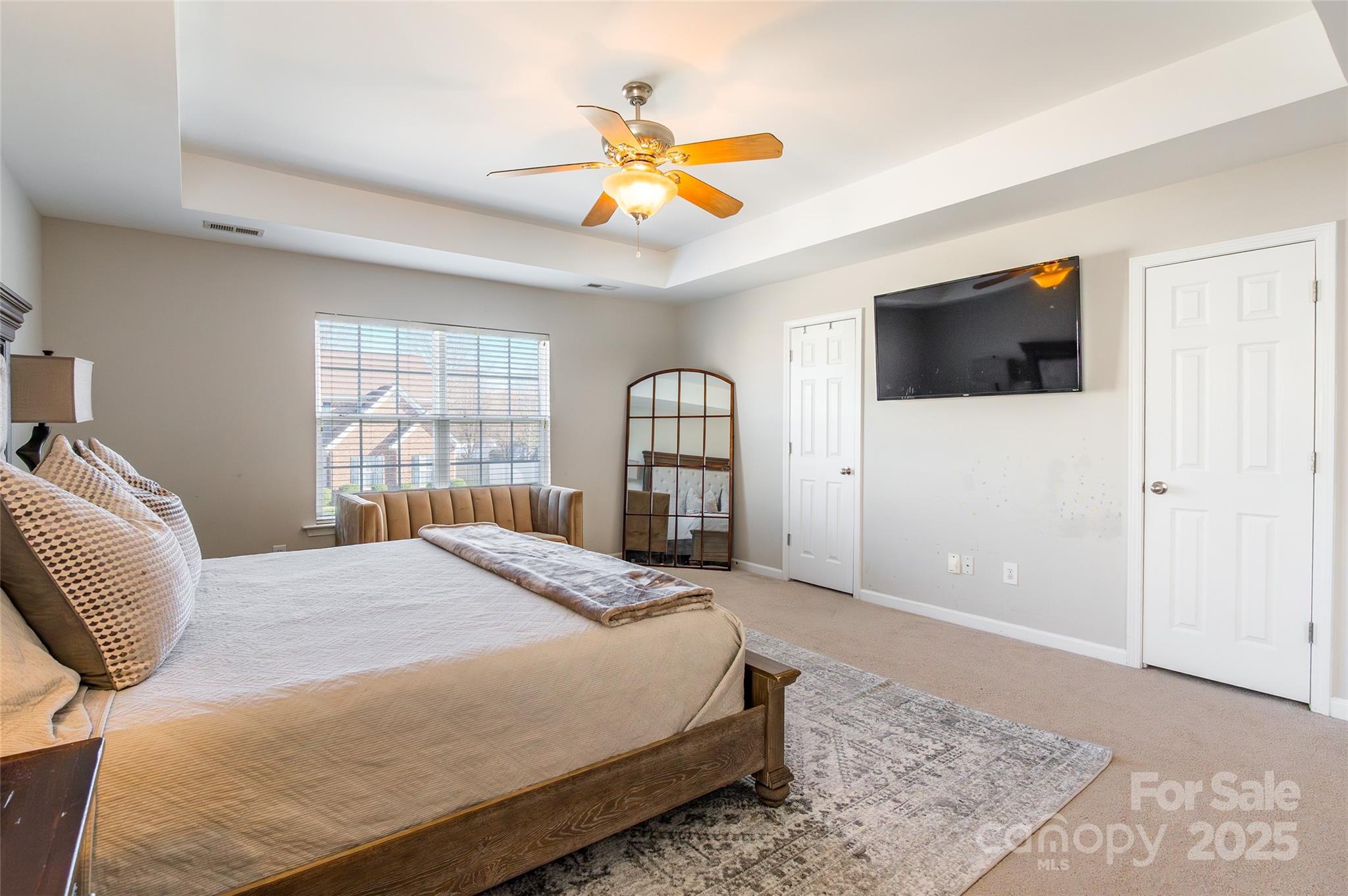 15127 Taylor Ridge Lane Charlotte, NC 28273 - Photo 26 of 42 a bedroom with a bed and a flat screen tv