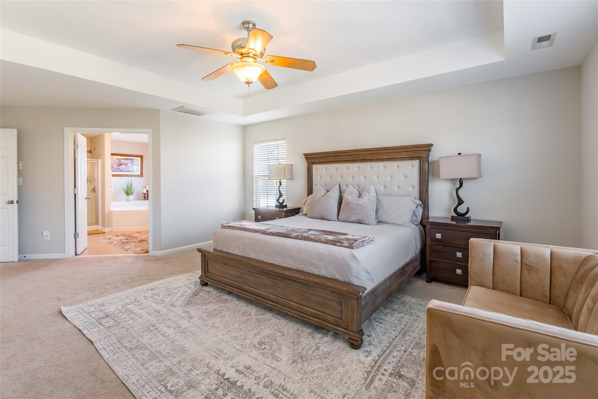 15127 Taylor Ridge Lane Charlotte, NC 28273 - Photo 27 of 42 a bedroom with a bed a couch and a dresser