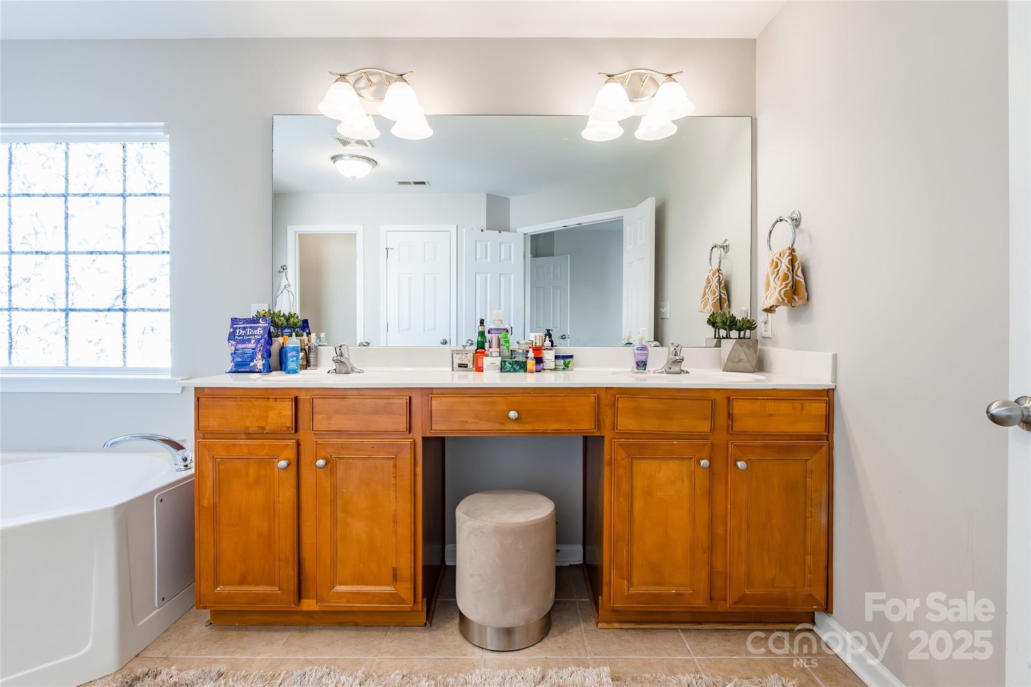 15127 Taylor Ridge Lane Charlotte, NC 28273 - Photo 28 of 42 a bathroom with a sink double vanity and a mirror
