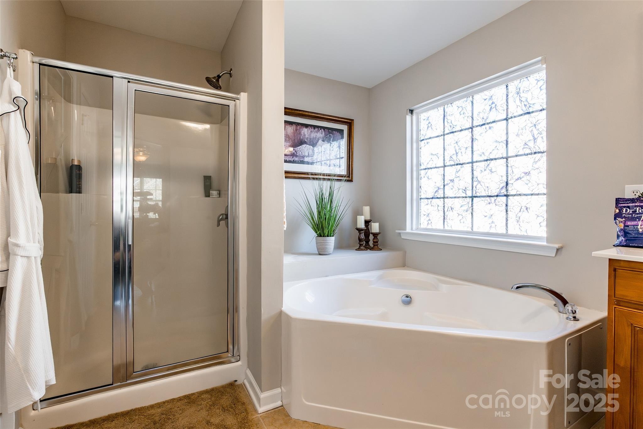 15127 Taylor Ridge Lane Charlotte, NC 28273 - Photo 29 of 42 a white bath tub sitting next to a window