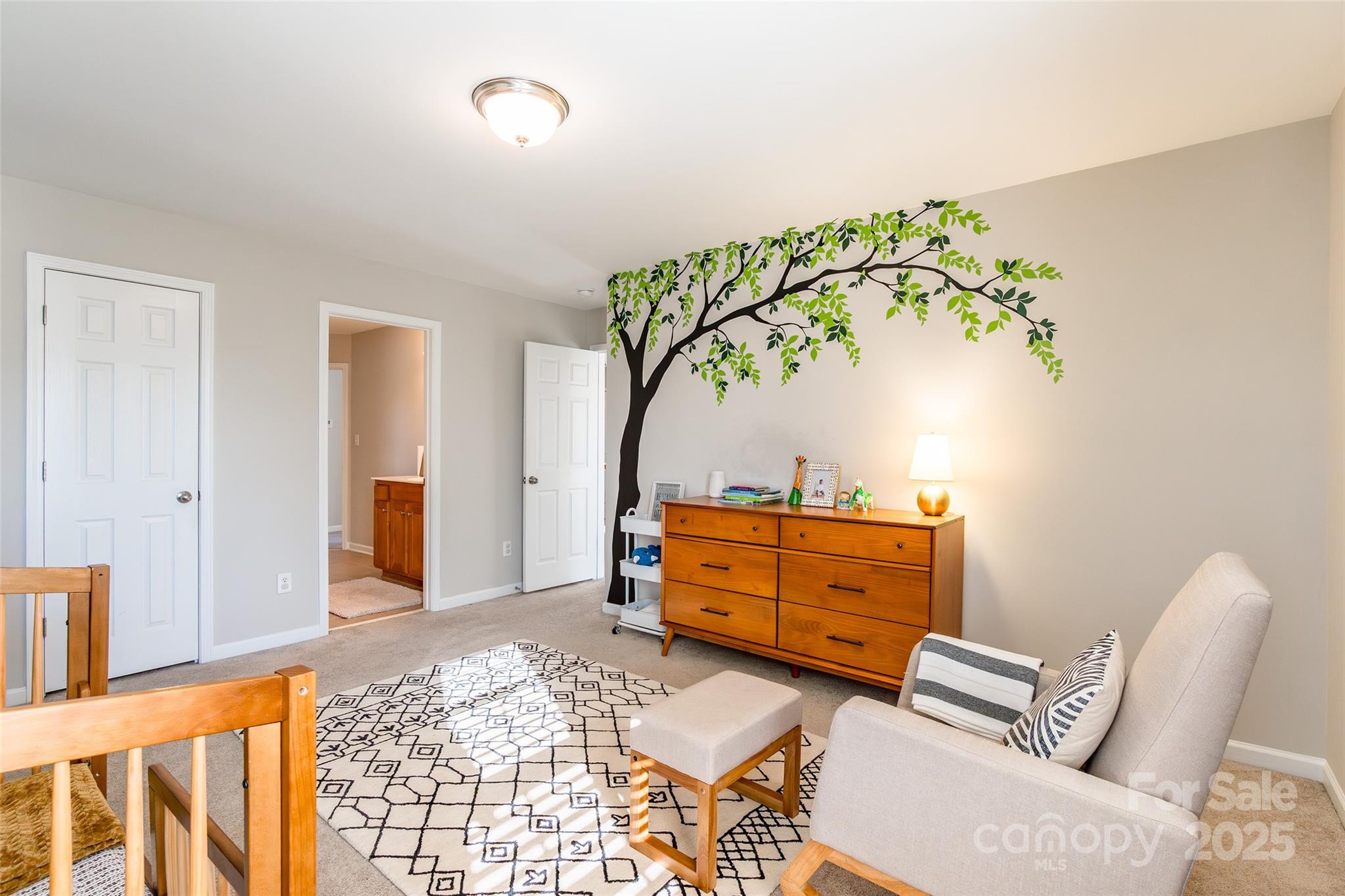 15127 Taylor Ridge Lane Charlotte, NC 28273 - Photo 31 of 42 a room with a chair and a dresser