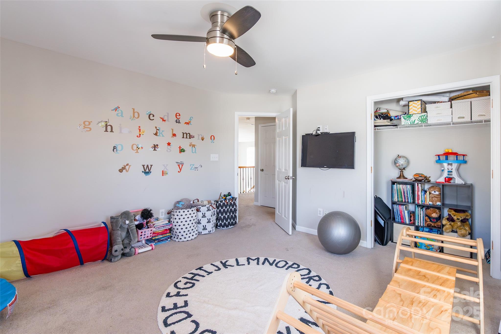 15127 Taylor Ridge Lane Charlotte, NC 28273 - Photo 38 of 42 a living room with furniture and a flat screen tv