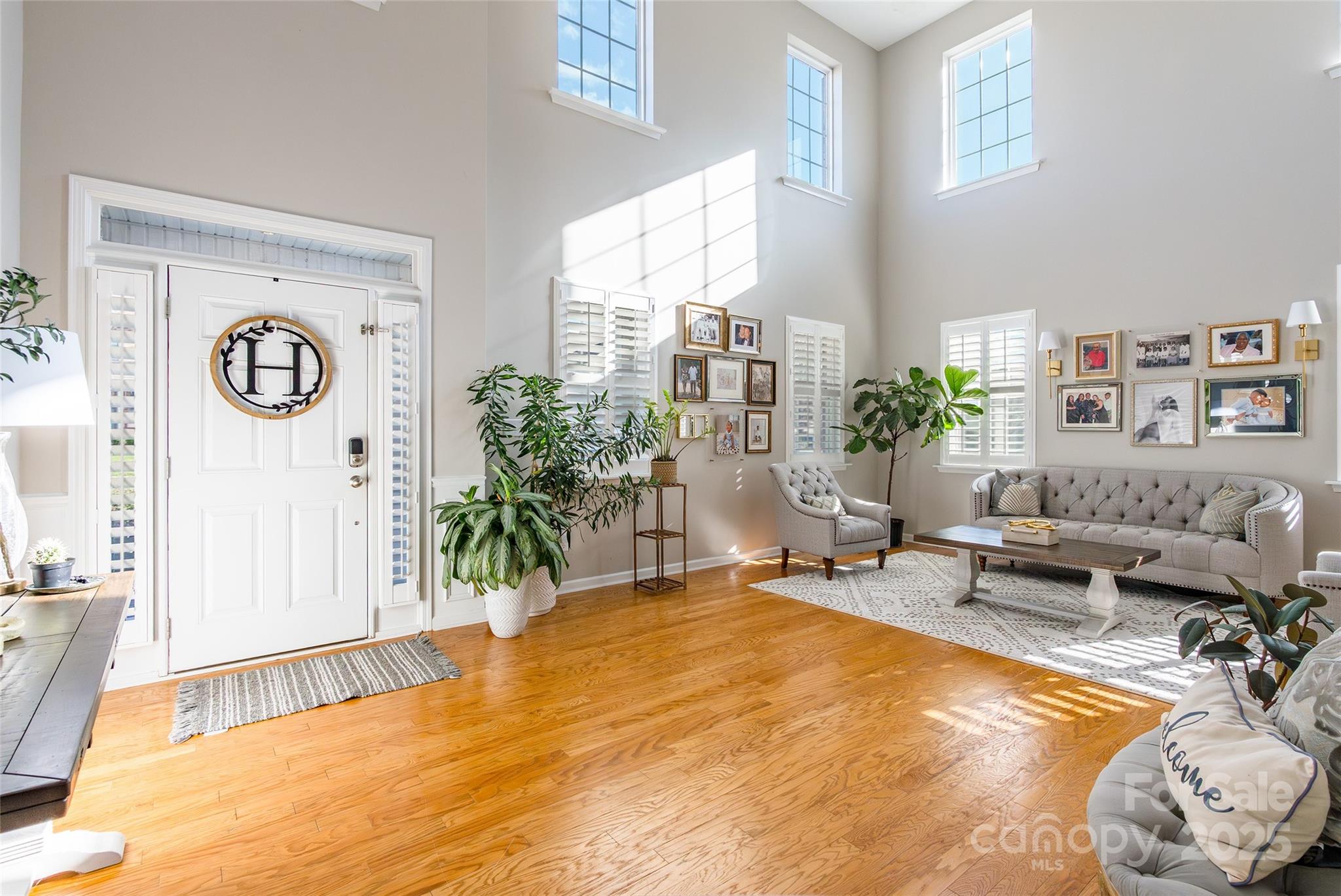 15127 Taylor Ridge Lane Charlotte, NC 28273 - Photo 4 of 42 a bedroom with furniture and a potted plant