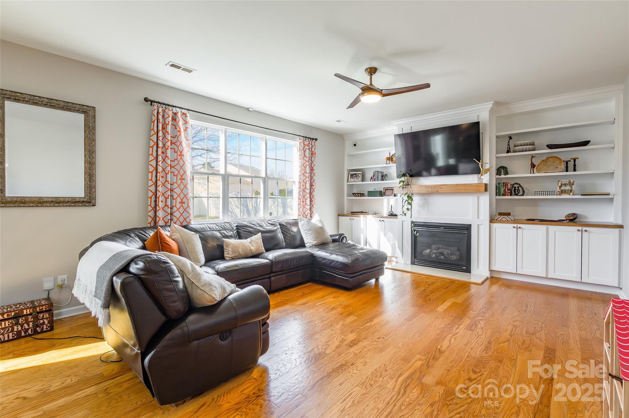 15127 Taylor Ridge Lane Charlotte, NC 28273 - Photo 7 of 42 a living room with furniture fireplace and flat screen tv