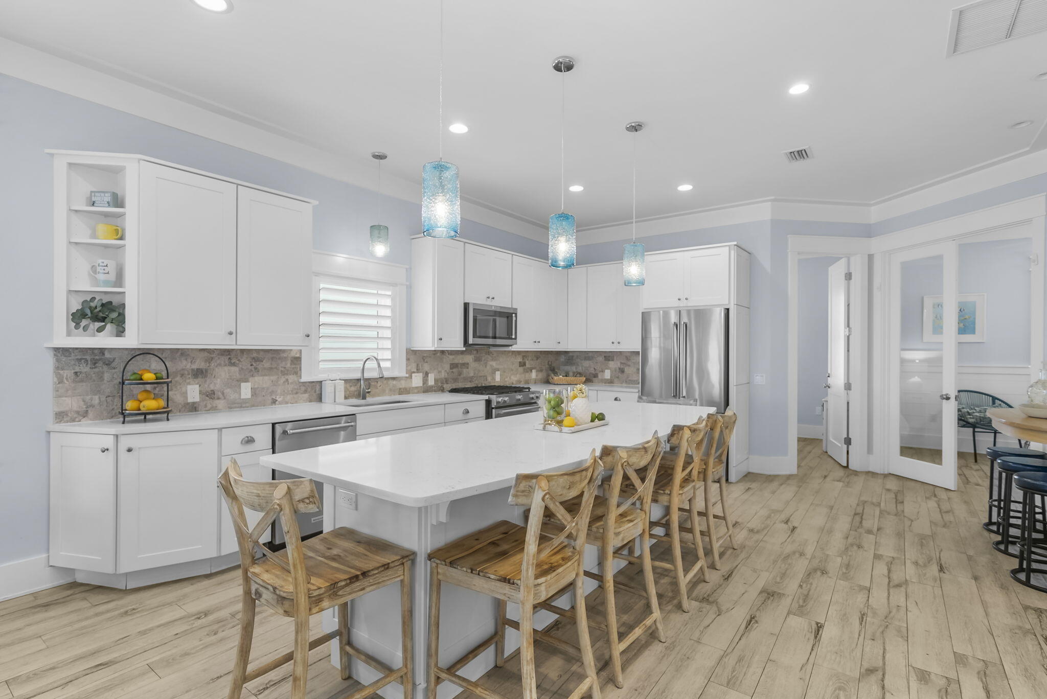 93 Emerald Cove Lane North Inlet Beach, FL 32461 - Photo 11 of 68 a large kitchen with a table and chairs