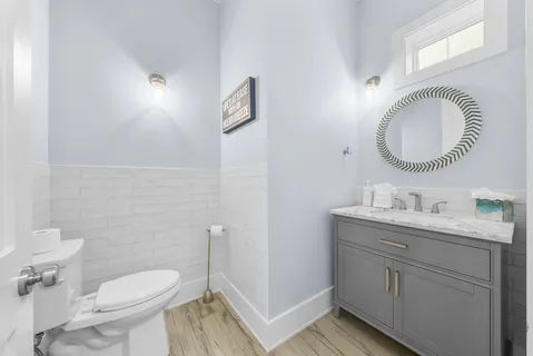 a view of an entryway with wooden floor and a front door