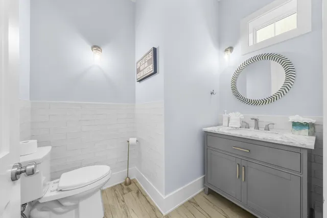 a view of an entryway with wooden floor and a front door