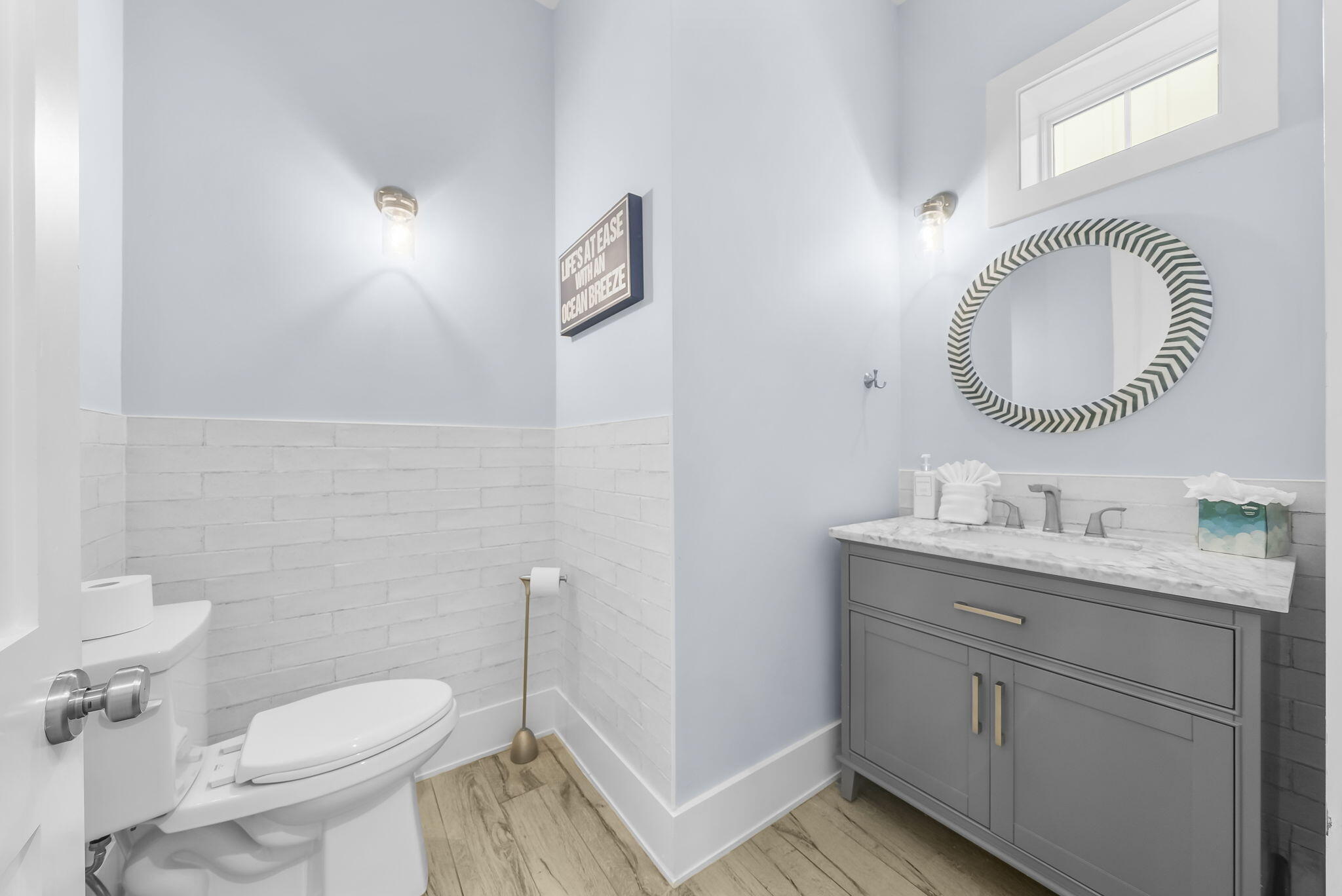 93 Emerald Cove Lane North Inlet Beach, FL 32461 - Photo 15 of 68 a bathroom with a granite countertop toilet a mirror and a sink