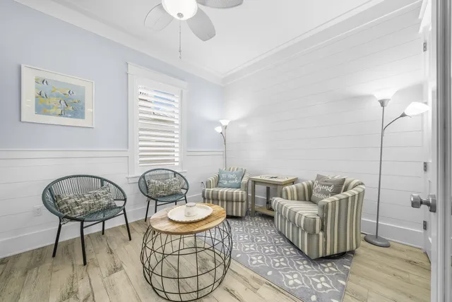 a spacious bedroom with a bed and a potted plant