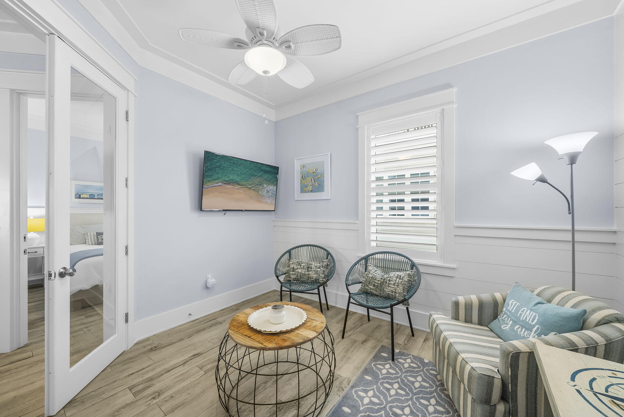 93 Emerald Cove Lane North Inlet Beach, FL 32461 - Photo 17 of 68 a living room with furniture a rug and a window