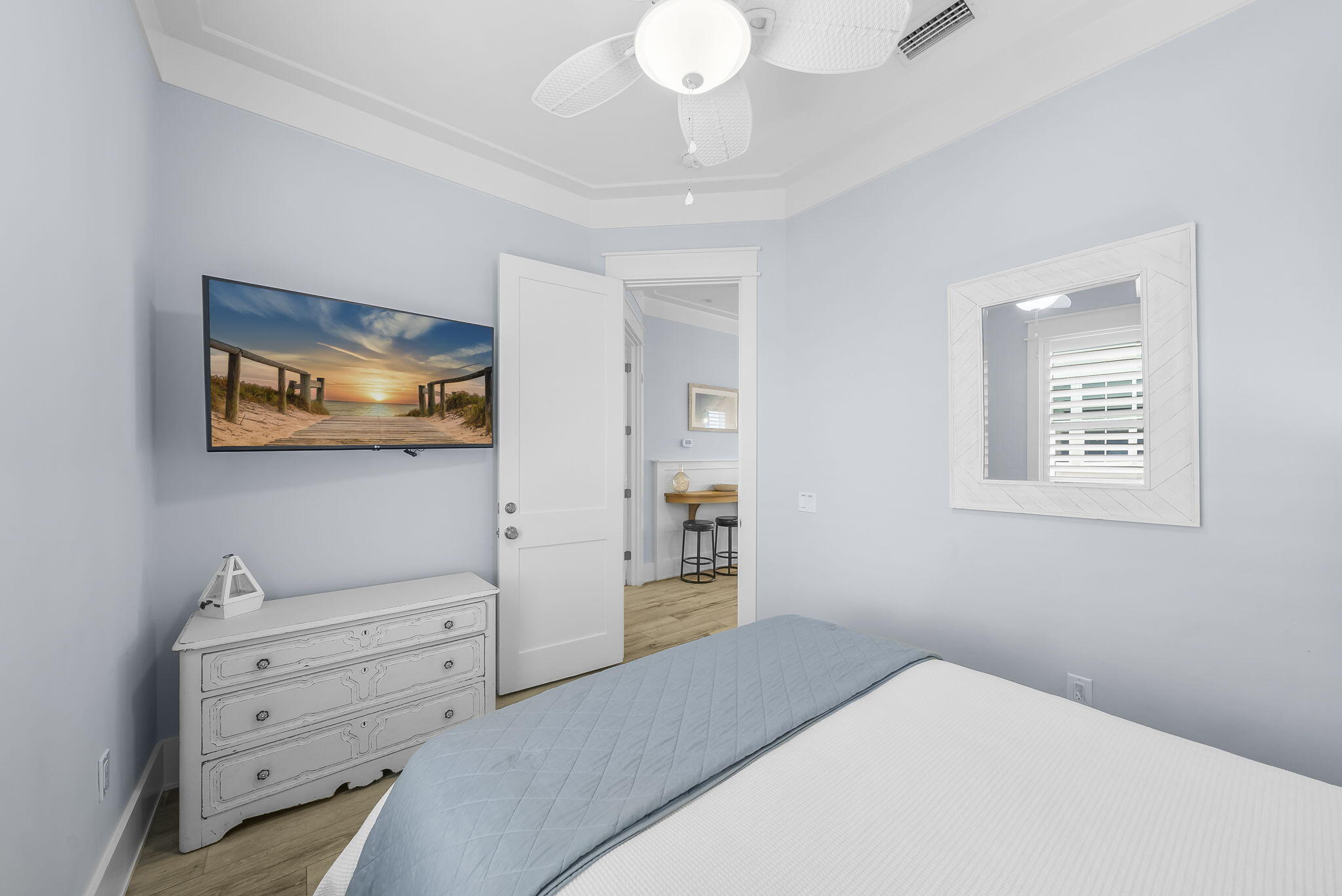 93 Emerald Cove Lane North Inlet Beach, FL 32461 - Photo 19 of 68 a bedroom with a bed and a chandelier