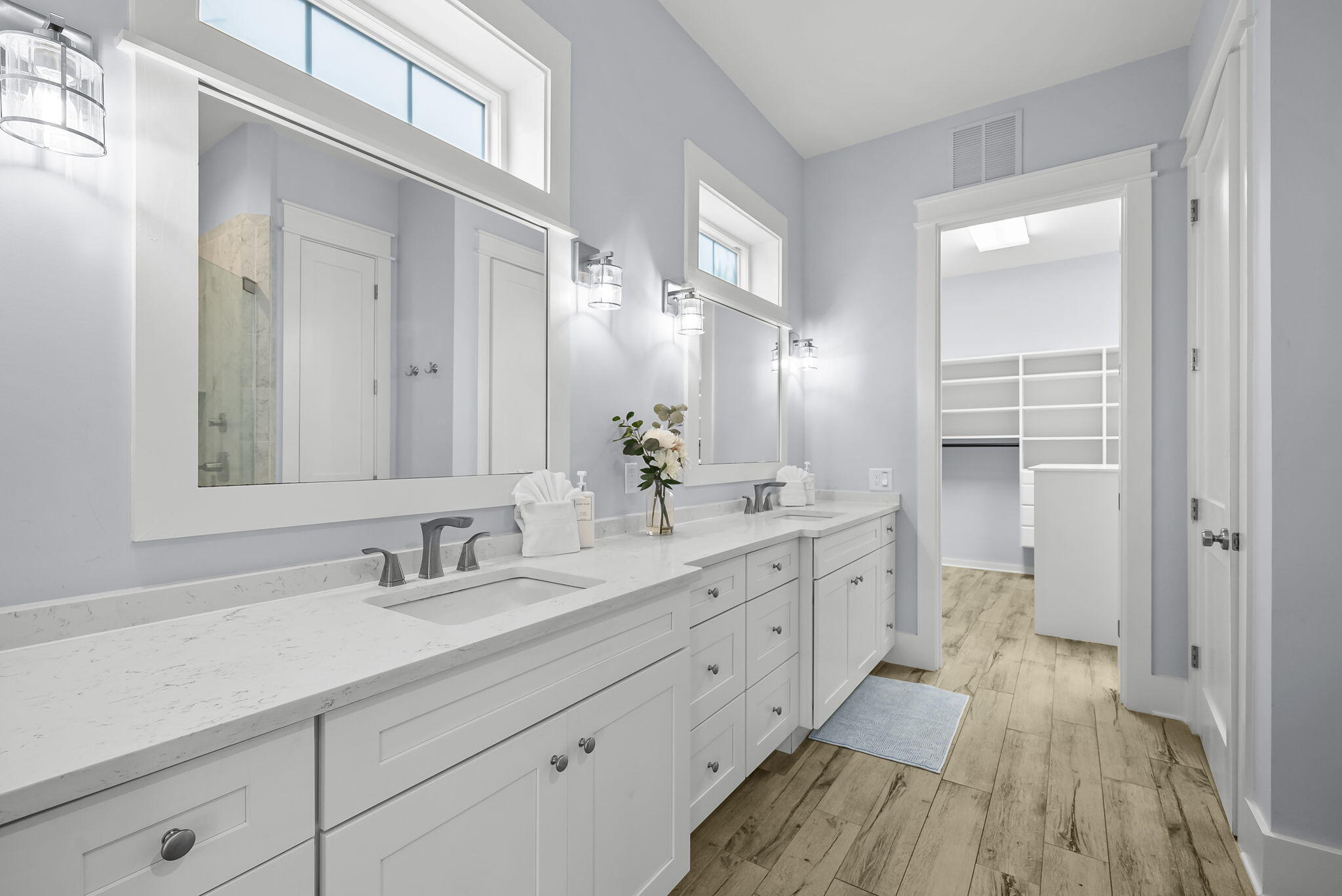 93 Emerald Cove Lane North Inlet Beach, FL 32461 - Photo 26 of 68 a spacious bathroom with a double vanity sink a mirror and a toilet