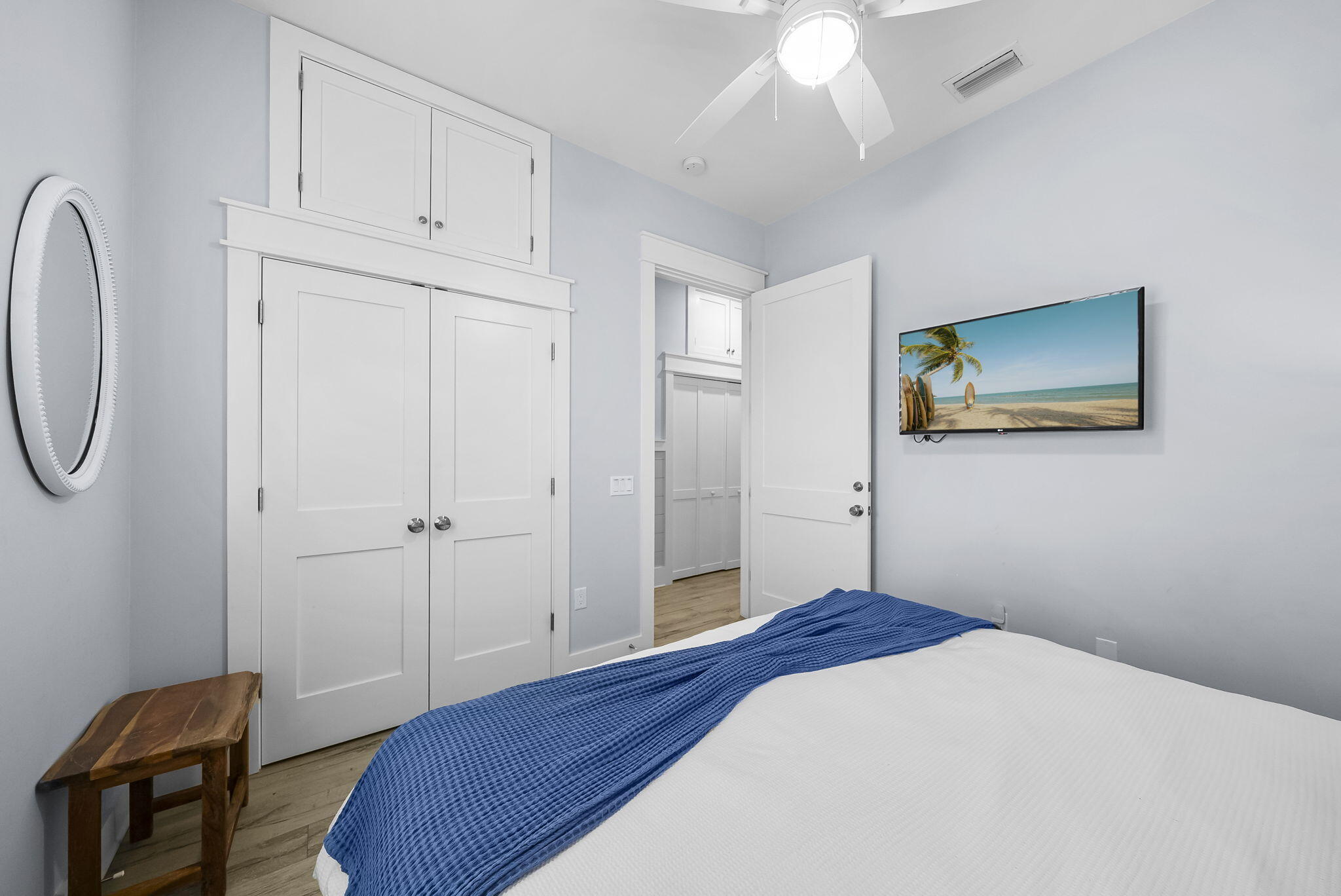 93 Emerald Cove Lane North Inlet Beach, FL 32461 - Photo 30 of 68 a bedroom with a bed and a chandelier