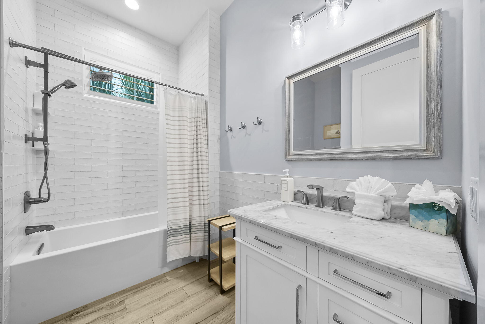 93 Emerald Cove Lane North Inlet Beach, FL 32461 - Photo 32 of 68 a bathroom with a sink and a mirror