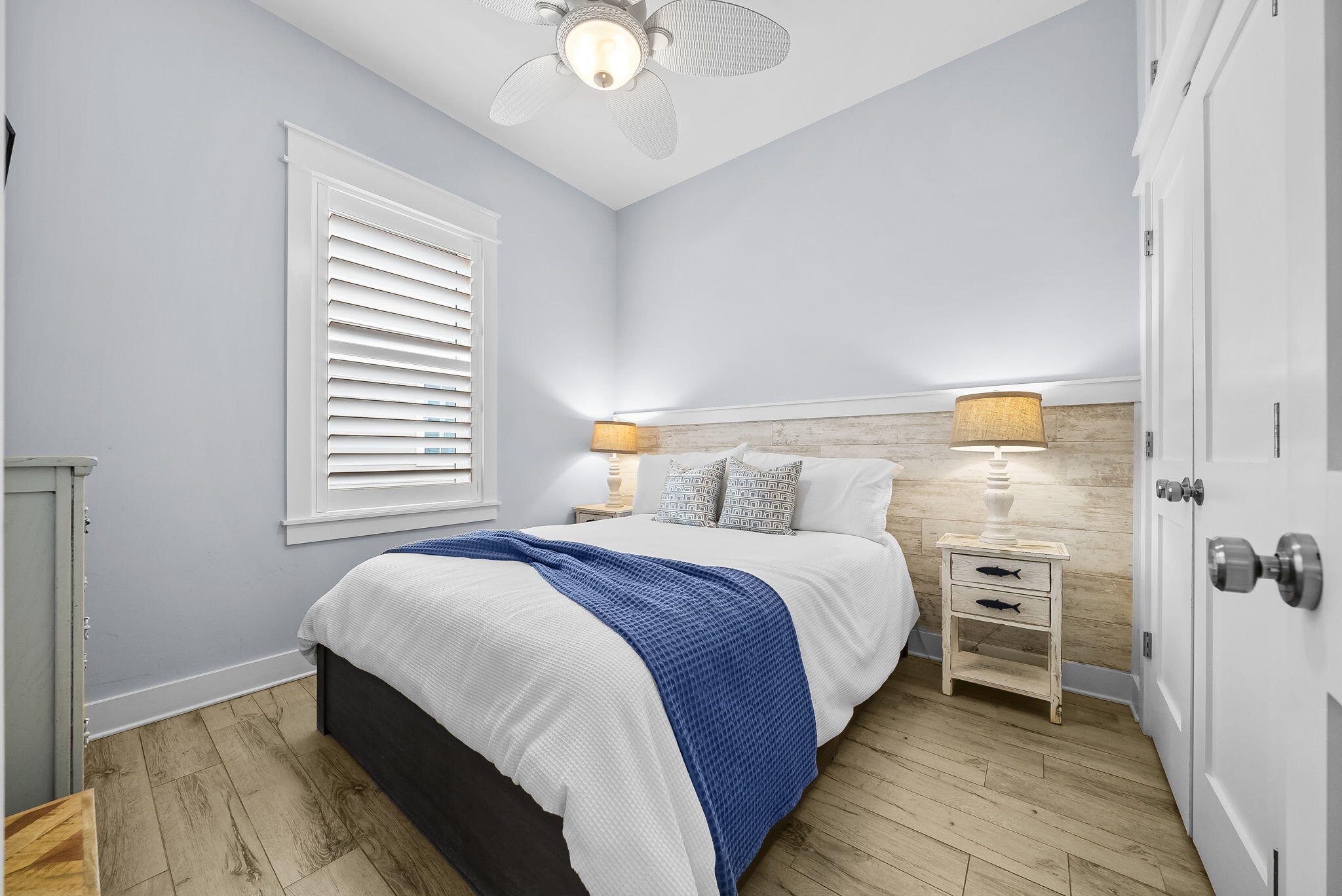 93 Emerald Cove Lane North Inlet Beach, FL 32461 - Photo 34 of 68 a bedroom with a bed and a chandelier