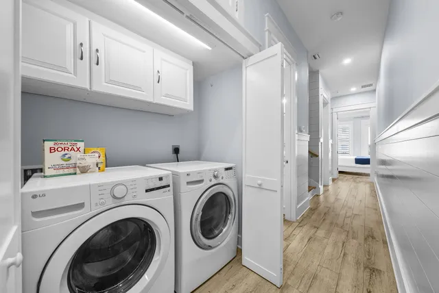 a view of a chairs and table in the back yard