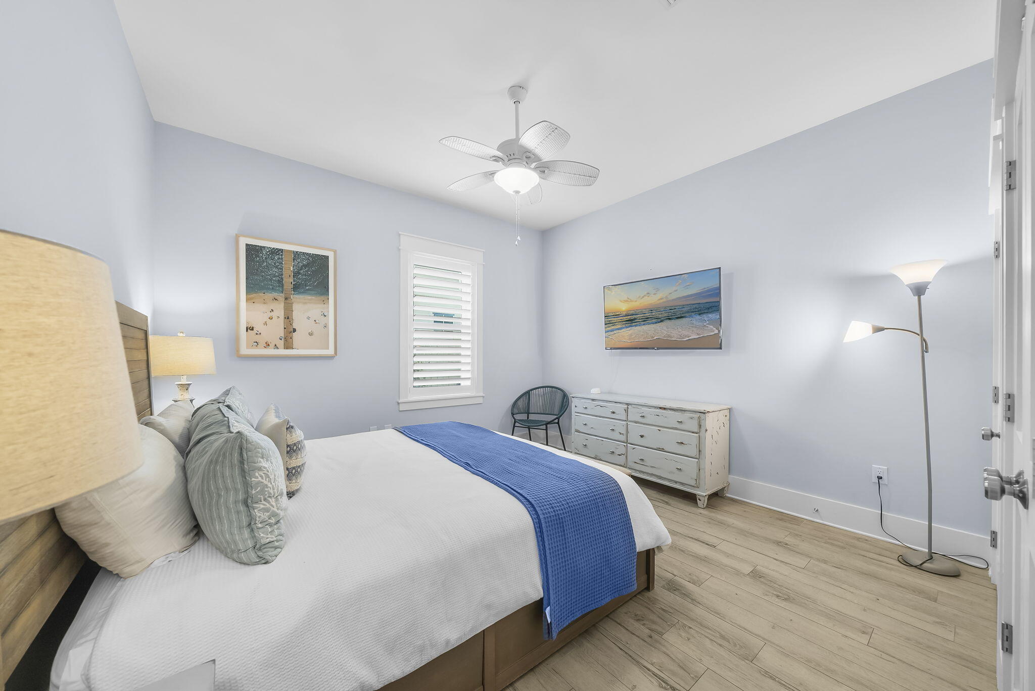 93 Emerald Cove Lane North Inlet Beach, FL 32461 - Photo 38 of 68 a bedroom with a bed and a chandelier