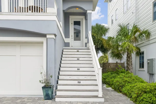 a view of an chairs and table in a balcony