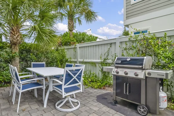 a view of a wooden deck and a backyard