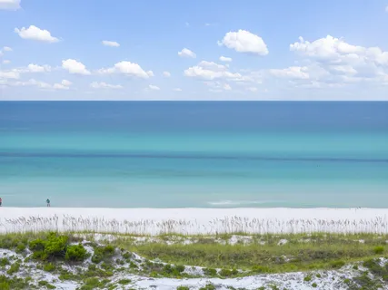 a view of a dinning table and chairs in patio