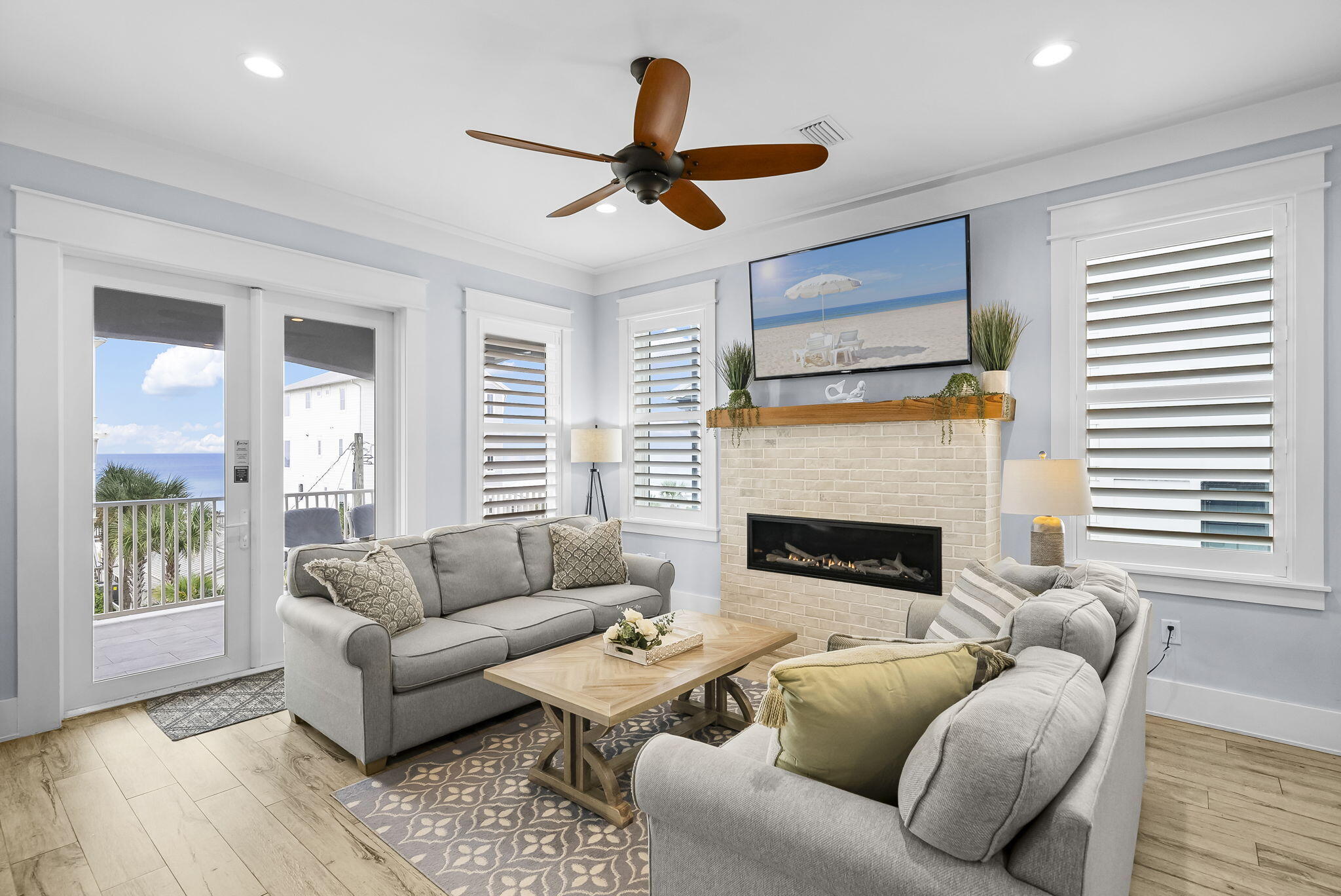 93 Emerald Cove Lane North Inlet Beach, FL 32461 - Photo 5 of 68 a living room with furniture and a fireplace