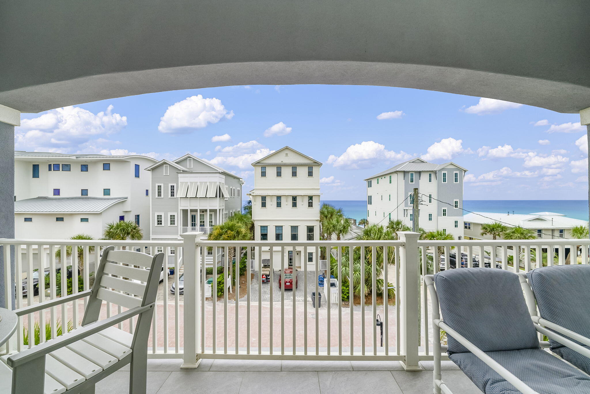 93 Emerald Cove Lane North Inlet Beach, FL 32461 - Photo 7 of 68 a view of an chairs and table in a balcony