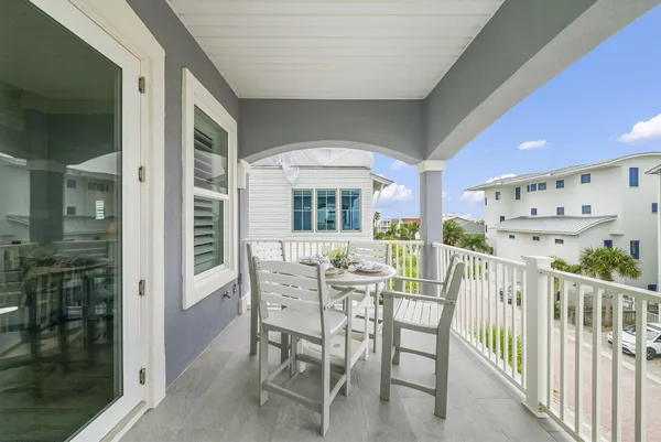 a large kitchen with a table and chairs