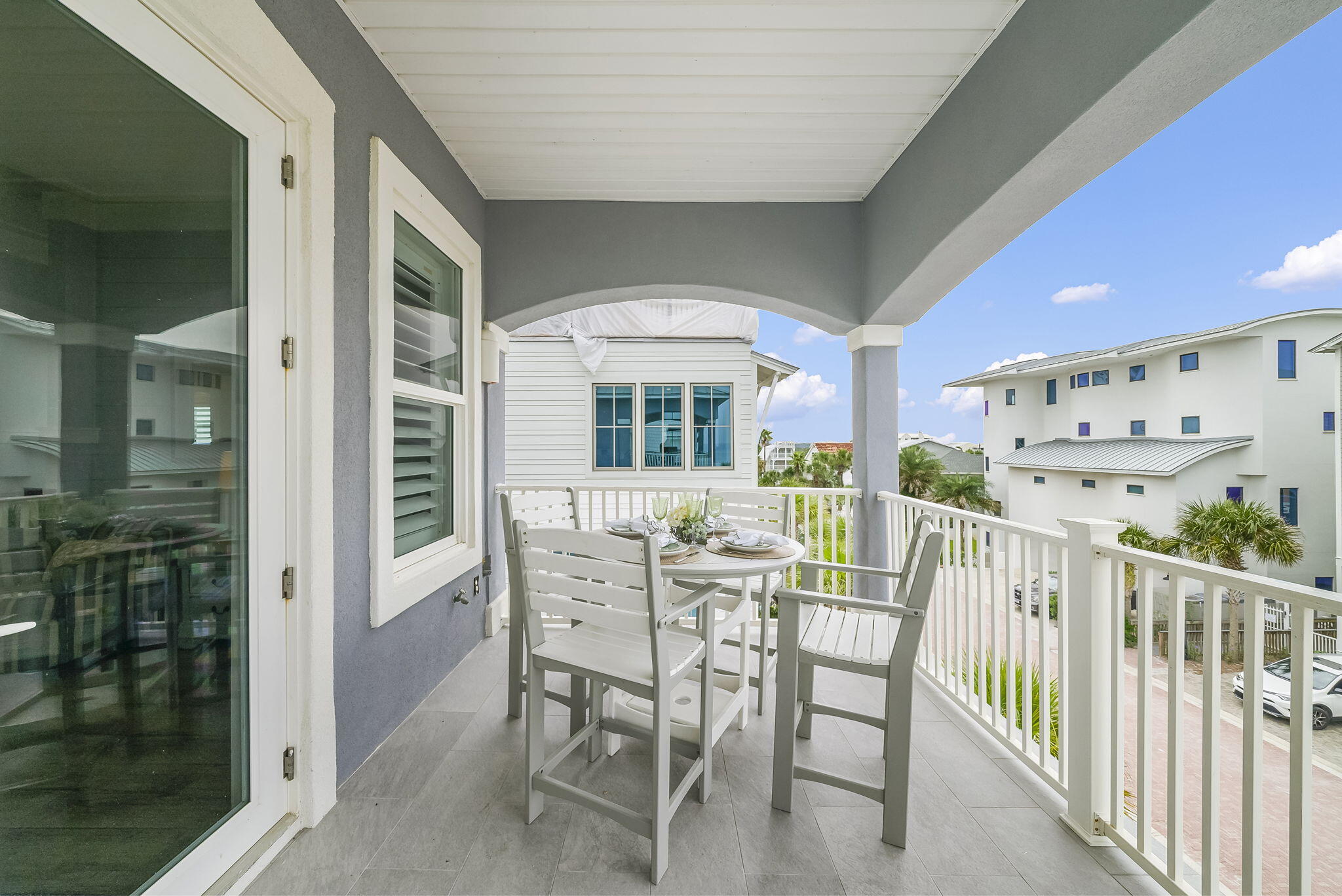 93 Emerald Cove Lane North Inlet Beach, FL 32461 - Photo 8 of 68 a view of a patio with a table and chairs in front of it