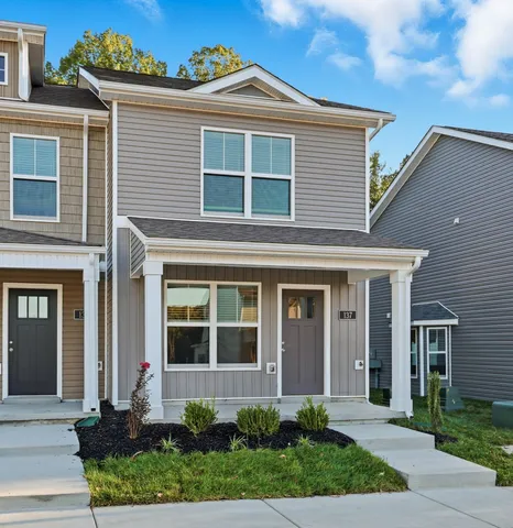a front view of a house with garden