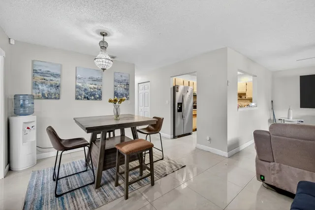 a bathroom with a sink a toilet a shower and a mirror