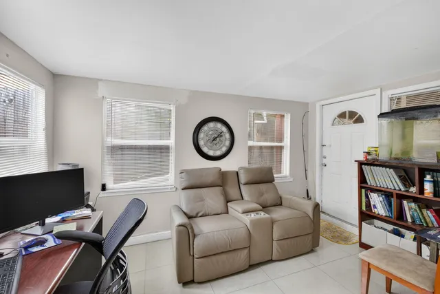 a room with a bed and a chandelier