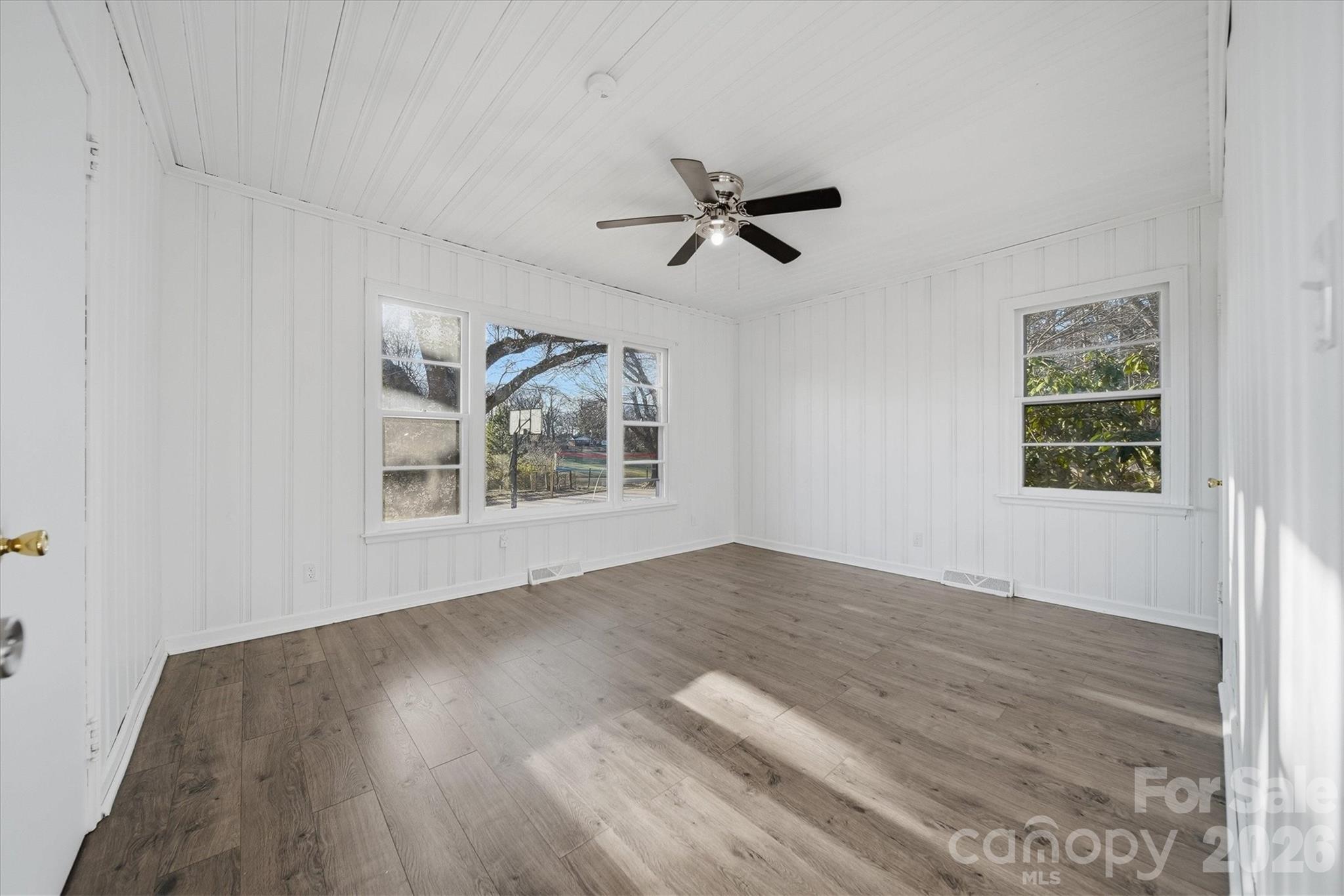 915 Airport Road Shelby, NC 28150 - Photo 11 of 37 a view of empty room with wooden floor and fan