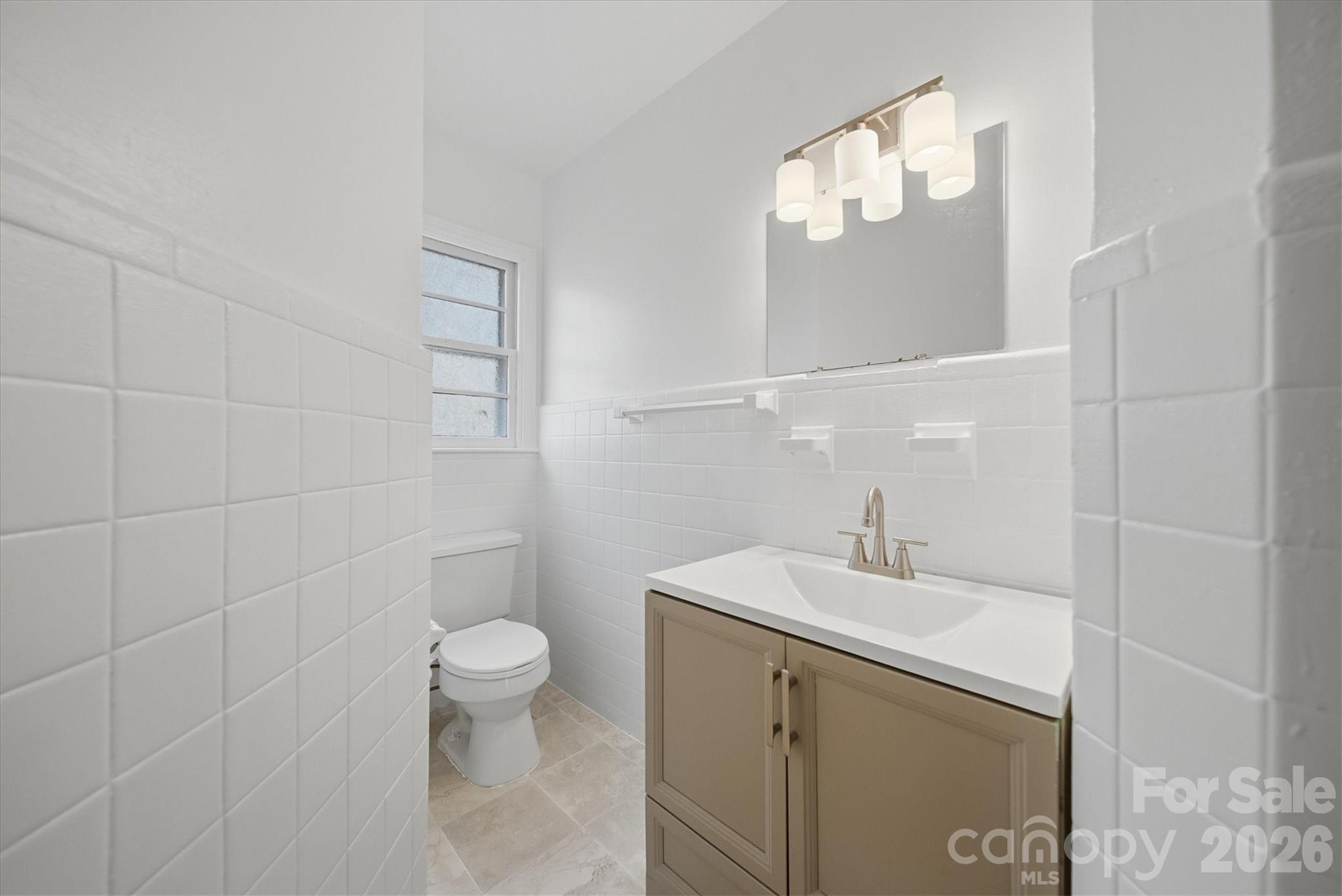 915 Airport Road Shelby, NC 28150 - Photo 17 of 37 a bathroom with a sink a toilet and a mirror