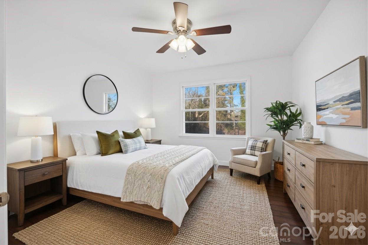 915 Airport Road Shelby, NC 28150 - Photo 19 of 37 a bedroom with a bed a chandelier and window