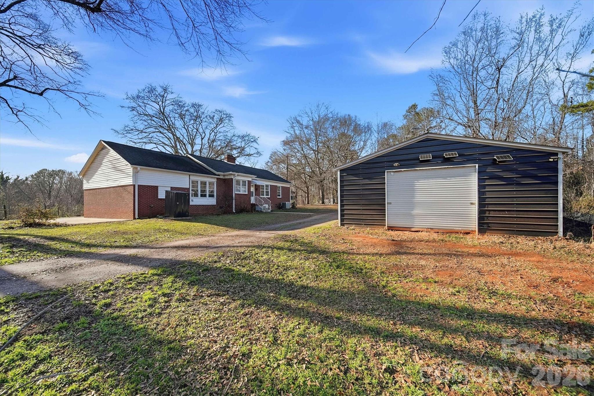 915 Airport Road Shelby, NC 28150 - Photo 26 of 37 a front view of a house with a yard