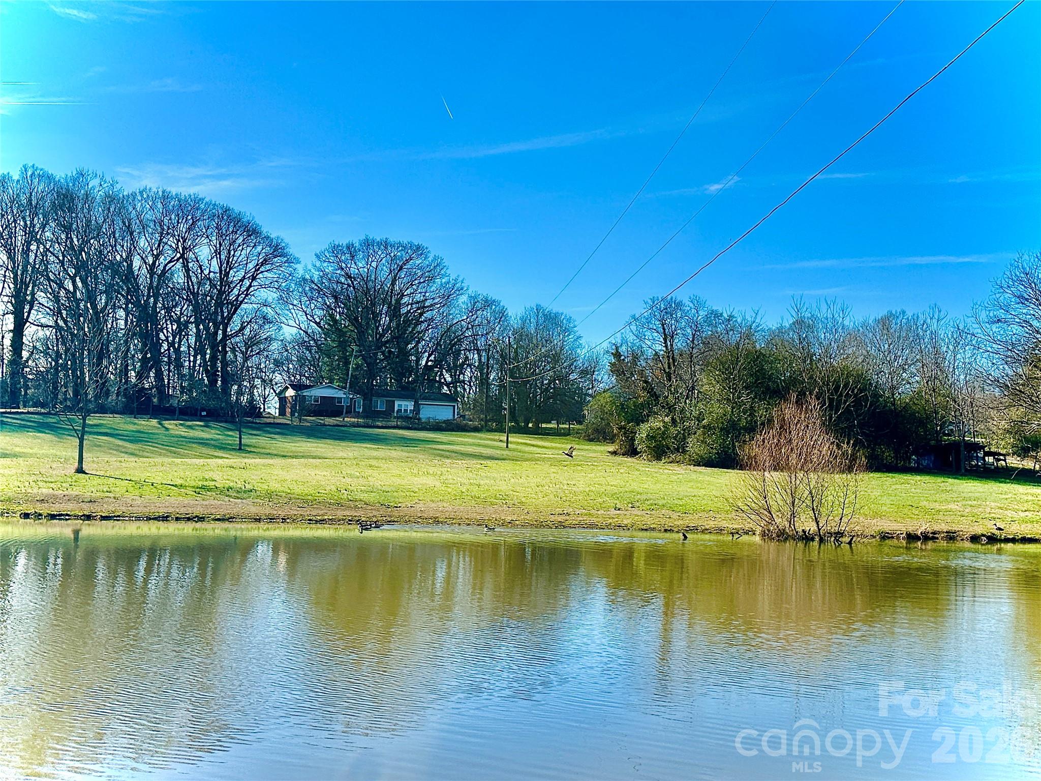 915 Airport Road Shelby, NC 28150 - Photo 30 of 37 a view of a lake with a yard