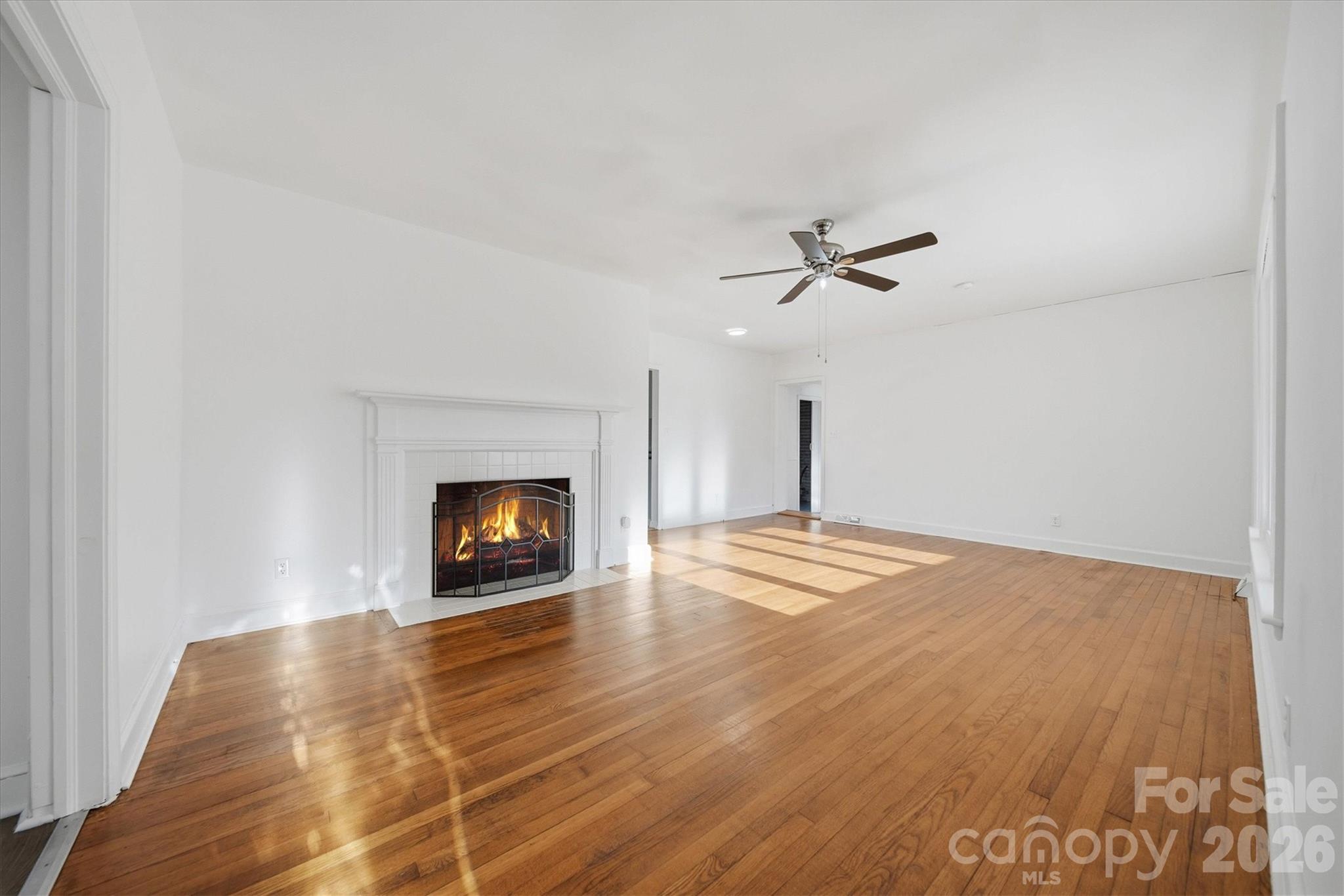 915 Airport Road Shelby, NC 28150 - Photo 4 of 37 a view of a room with a ceiling fan and wooden floor